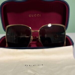 Gucci Women's Gold Frame Sunglasses with Dark Lenses